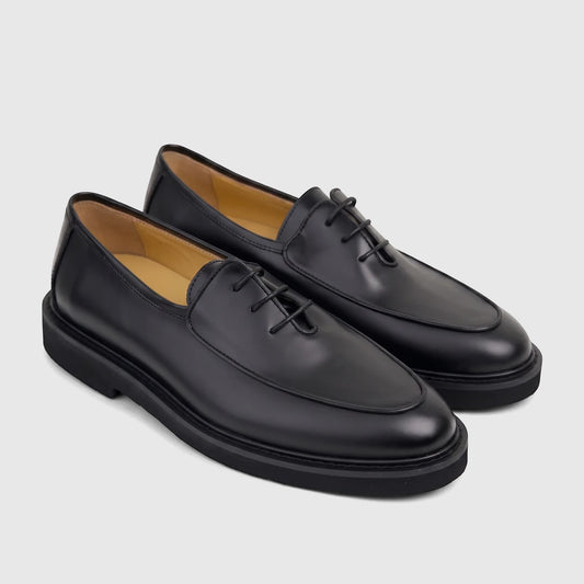 Bulletti Men's black leather chunky sole lace-up shoe, B7799M Odyssey Black Patent, shown from a side view.