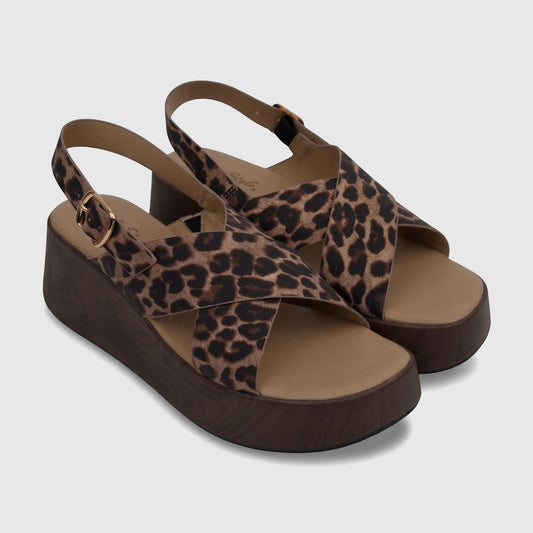 Ladies' HP Soft Style Jemma Comfort Wedge Sandal with leopard print upper and dark wood-look platform, side view.