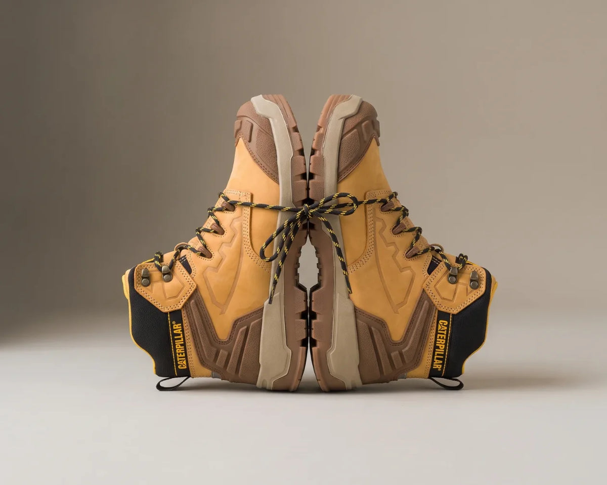 Cat Men's Grapple Leather Mid P727011 shoe in coffee bean brown, featuring a durable design and rugged sole, shown in a side