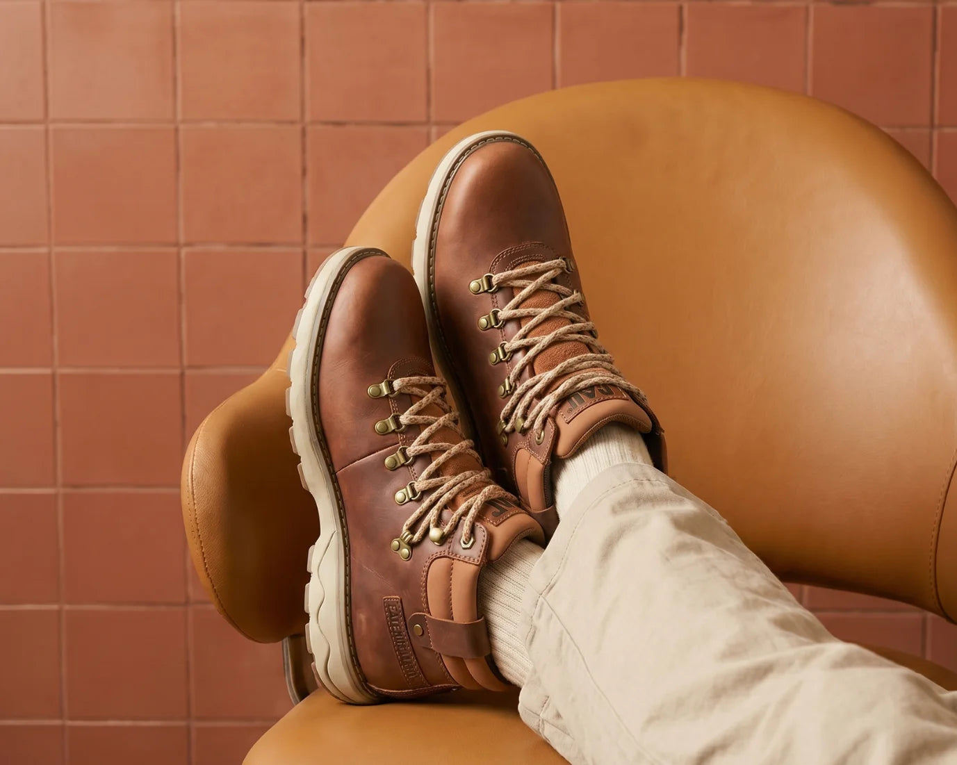 Formales Men's black leather lace-up boot, FD265008, featuring smooth and pebbled textures with a brown stacked heel.