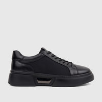 A single men's Babucci K13050401-1 black leather sneaker with a thick sole and prominent lacing, captured in a side view.