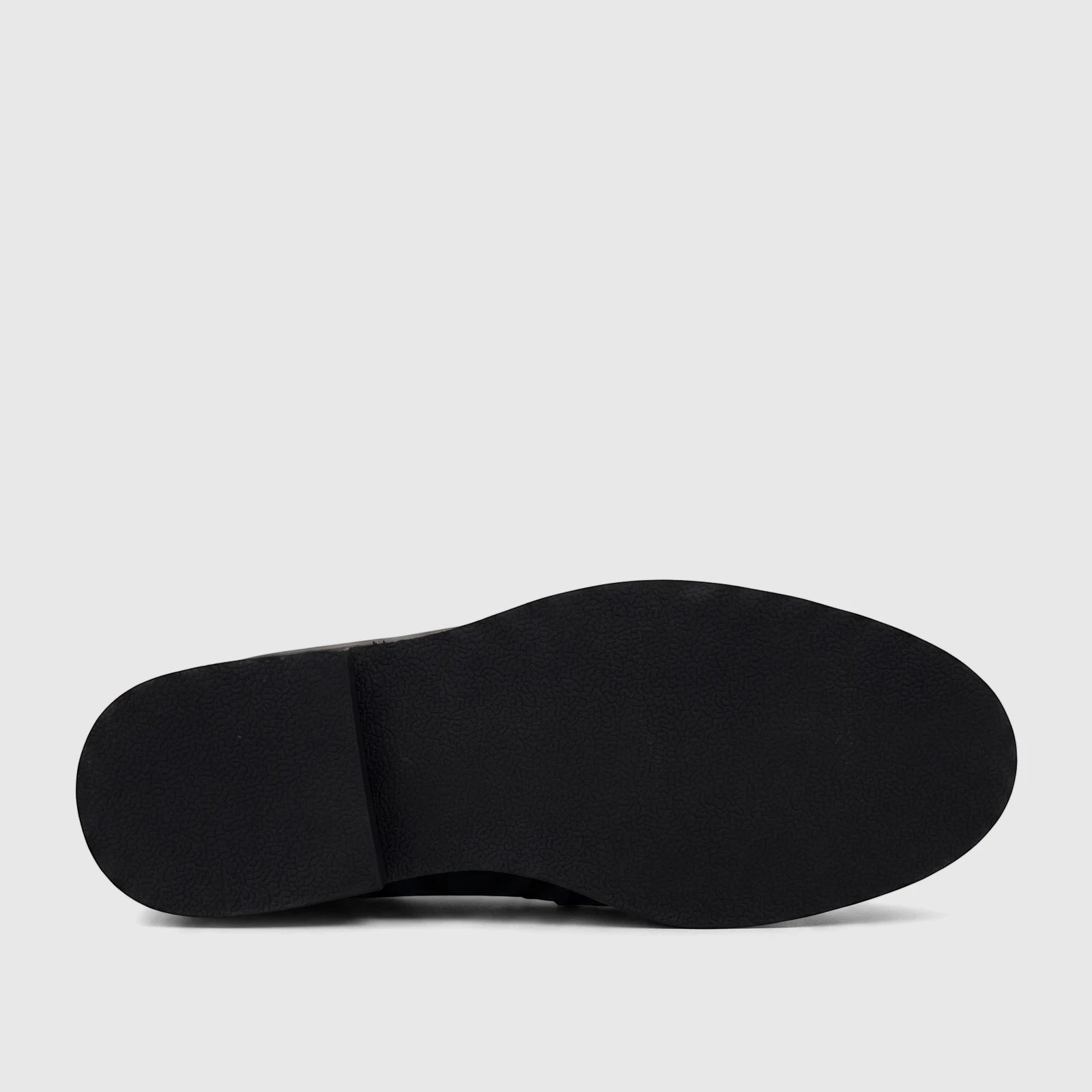 View of the black textured rubber sole of a Barker men's dress slip-on shoe, featuring a defined heel.