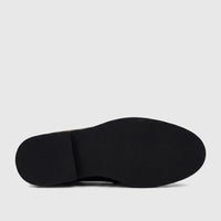 View of the black textured rubber sole of a Barker men's dress slip-on shoe, featuring a defined heel.