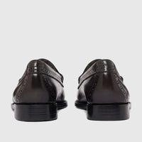 Back view of Bass Men's Loafer Weejun Venetian Brogue in black leather, showcasing the detailed perforations and glossy
