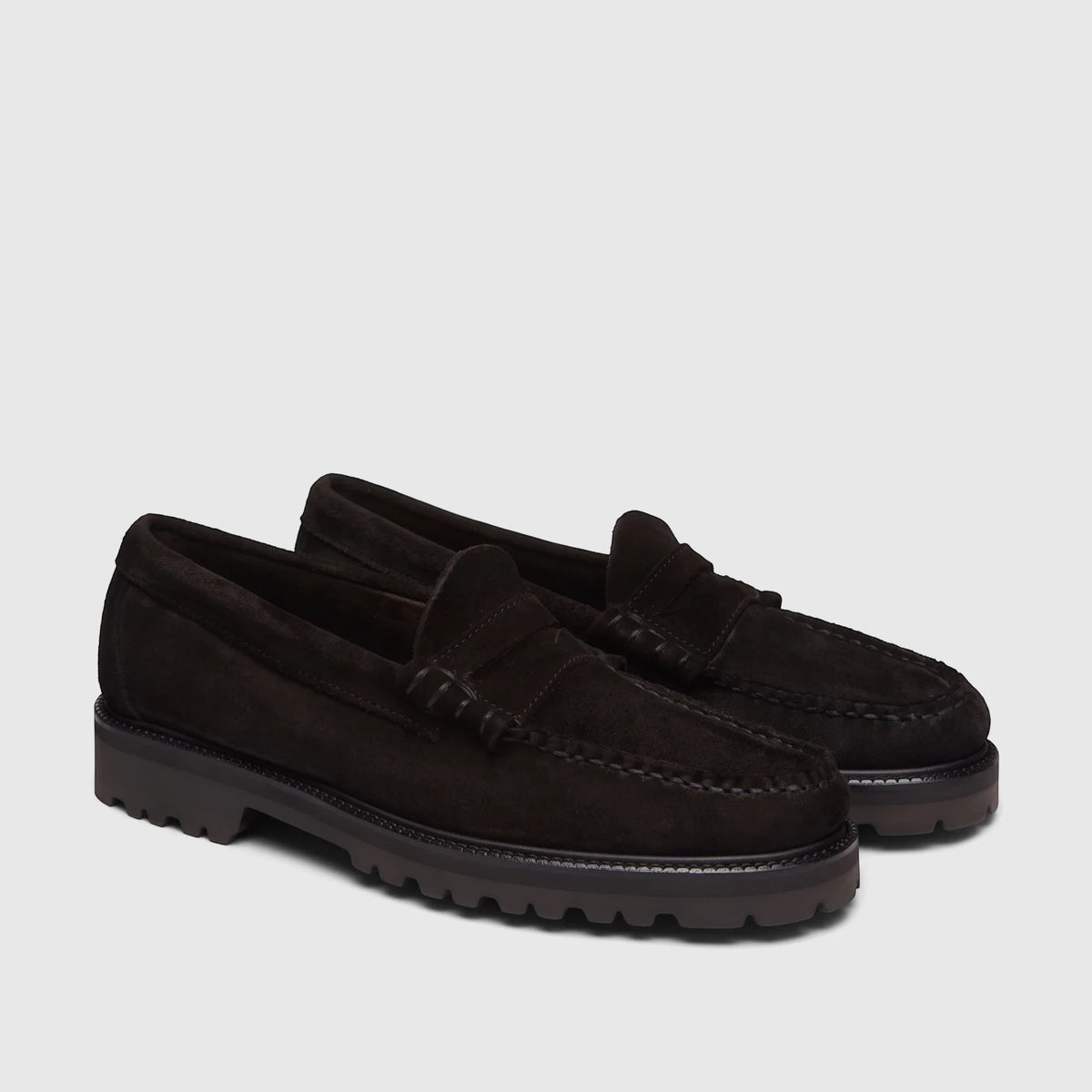 A pair of black suede men's chunky sole loafers with visible stitching and lug soles.