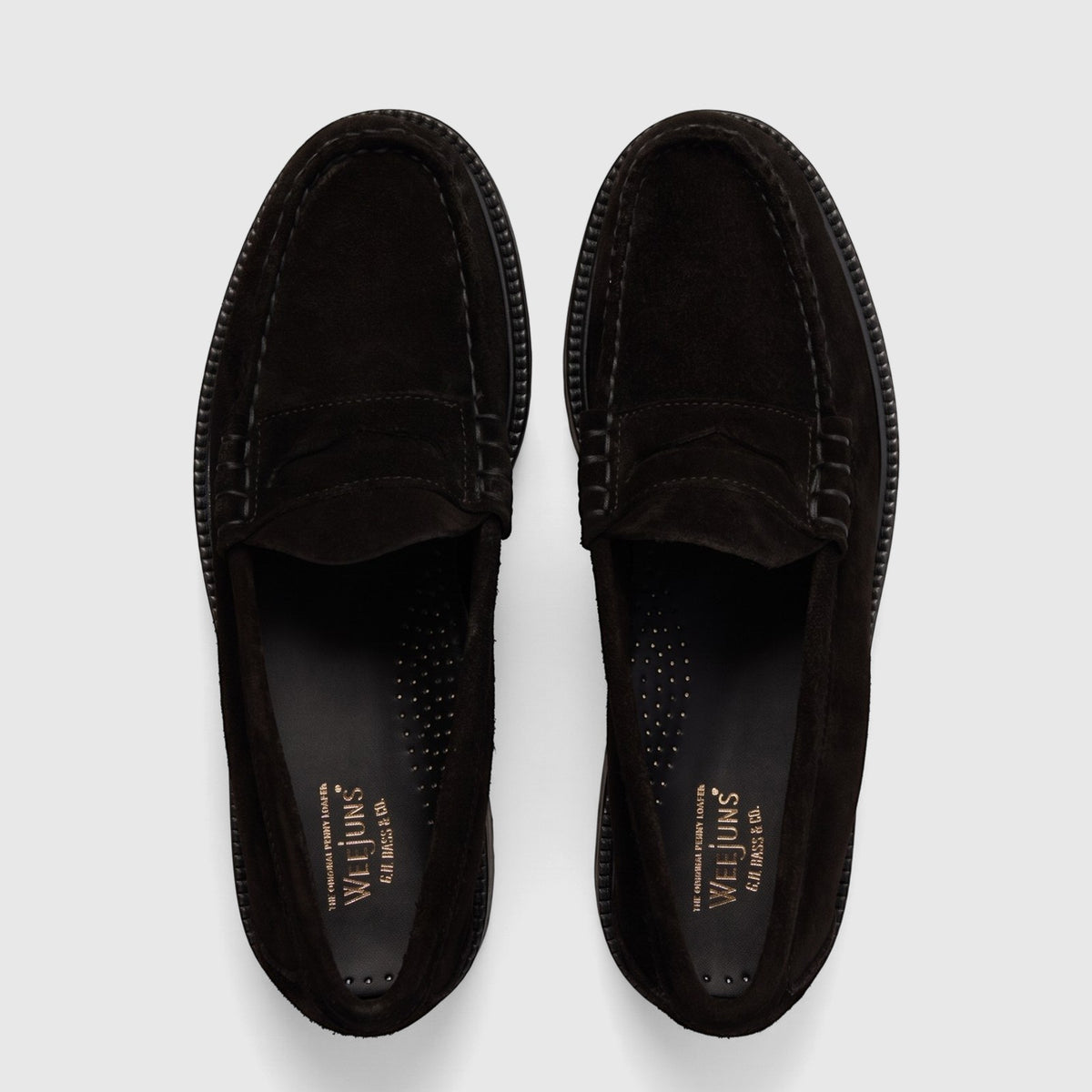 Pair of Bass Men's Weejun Lug Larson loafers in black suede, featuring a chunky sole and classic penny strap design, viewed