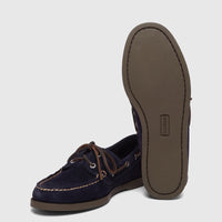 A pair of G.H. Bass Men's Jetty II Boater shoes in navy suede, with brown leather laces and white stitching.