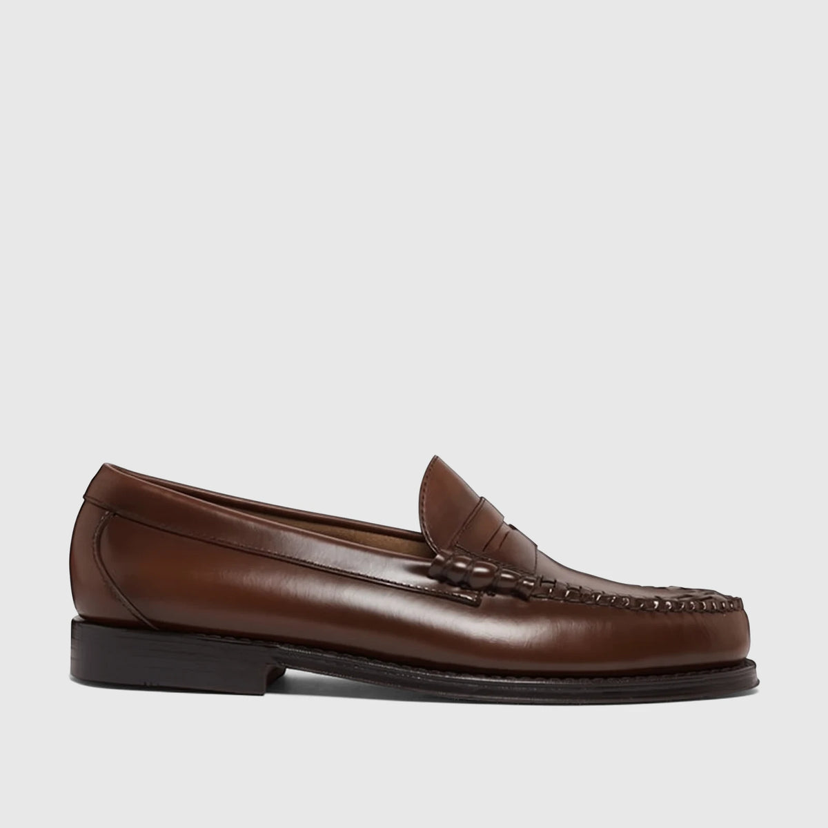 Bass Men's Loafer Larson Weave in mid brown leather, featuring an intricate woven vamp and classic penny slot, side view.