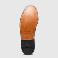 Bottom view of a Bass Men's Loafer Weejun Larkin Moc Tassel shoe in dark green leather, showing the tan leather and black
