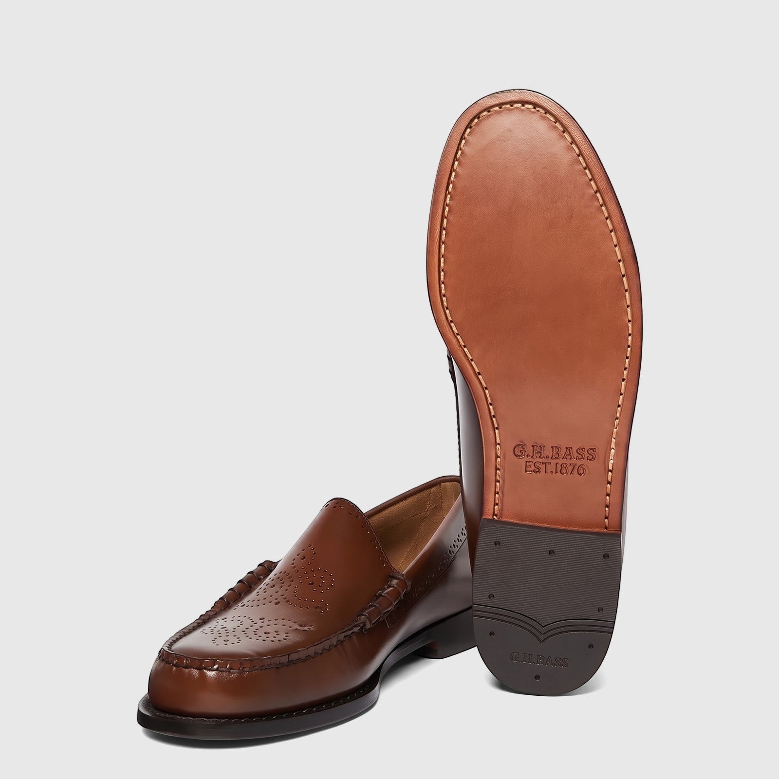 Bass Men's Loafer Weejun Venetian Brogue BA11007 in brown leather, displayed with one shoe upright showing the sole and the