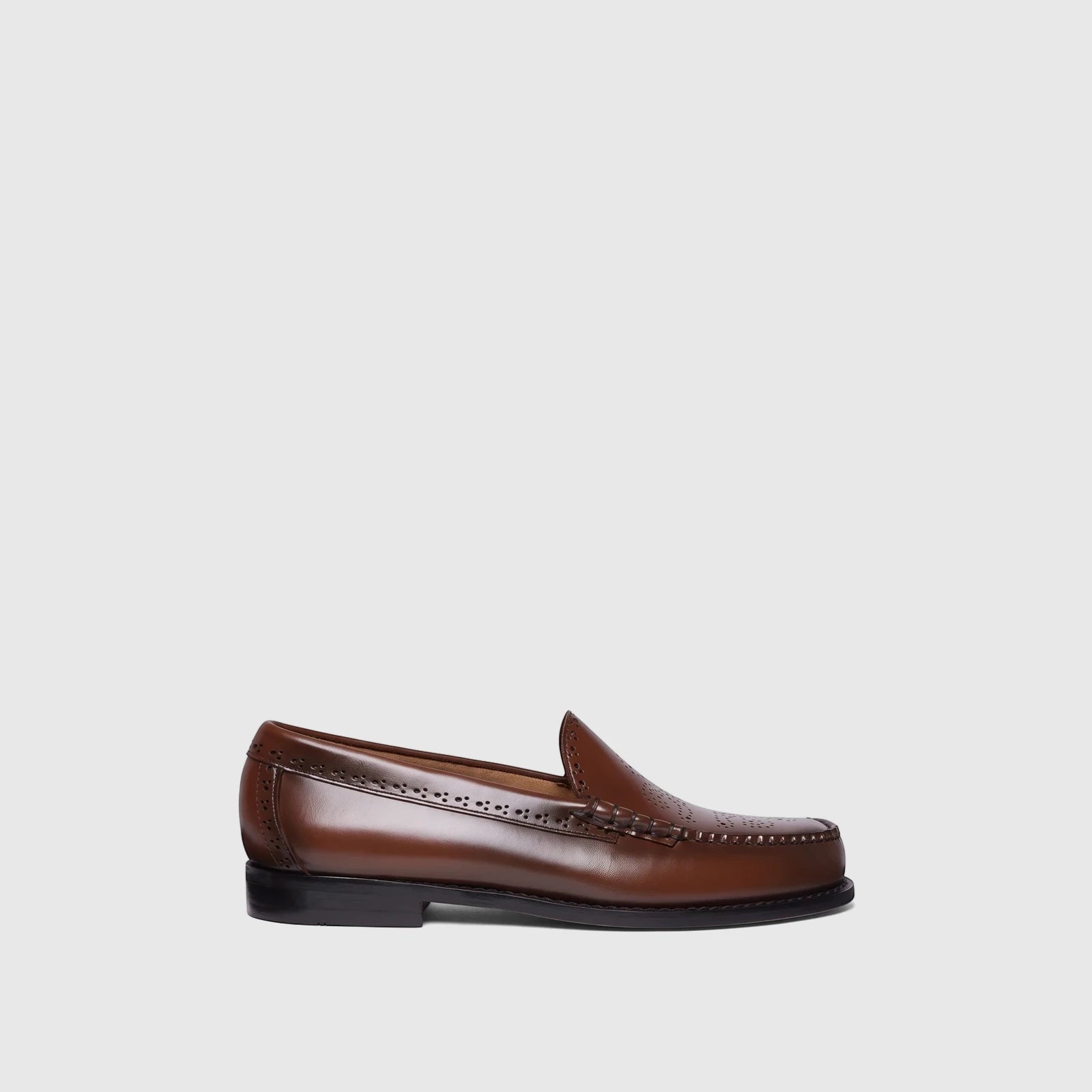 Men's brown leather Venetian brogue loafers with subtle perforations and a classic penny strap design.