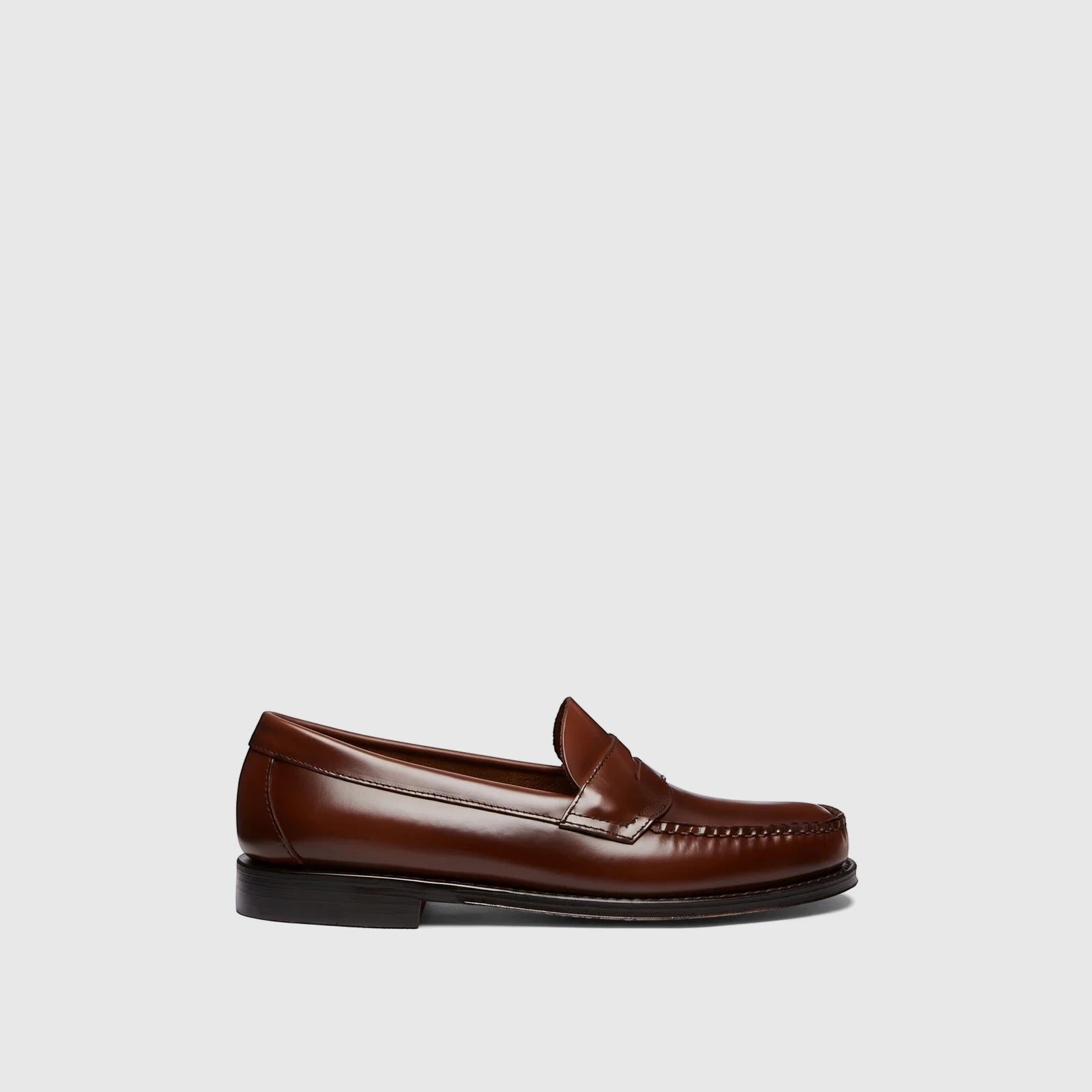 Brown leather Bass Men's Weejun Logan penny loafer, seen from the side with a polished finish.