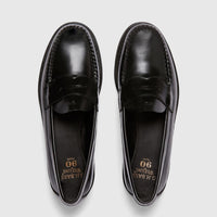 Top-down view of a pair of men's G.H. Bass Weejun Logan penny loafers in shiny black leather, showcasing the classic design