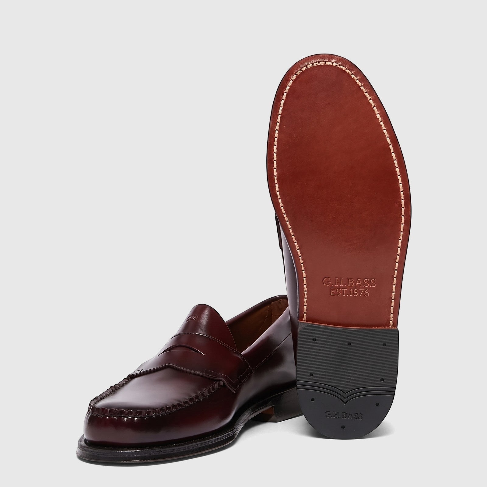 Bass Men's Weejun Logan Penny Loafer in rich wine leather, showcasing classic design and durable outsole.