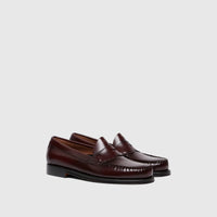 Pair of Bass Men's Weejun Logan Penny Loafers in rich wine leather, showcasing the classic penny strap and stitch detailing.