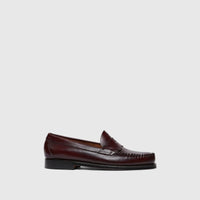 Bass Men's Weejun Logan Penny Loafer in wine leather, featuring a classic slip-on design and prominent stitching.