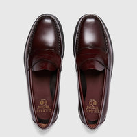 Pair of Bass Men's Weejun Logan Penny Loafers in rich wine leather, viewed from above, showcasing classic design.