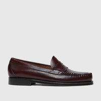 Bass Men's Weejun Logan Penny Loafer in shiny wine-colored leather, featuring a moc toe and penny slot.