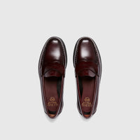 Pair of Bass Men's Weejun Logan Penny Loafers in wine-colored polished leather, shown from a top-down perspective.