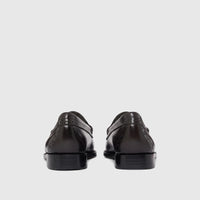 Rear view of Bass Men's Weejun Venetian brogue loafers in polished black leather, with intricate detailing on the heel.