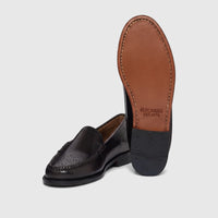 Bass Men's Weejun Venetian Brogue loafers in black leather, featuring brogue detailing and visible brown leather soles.