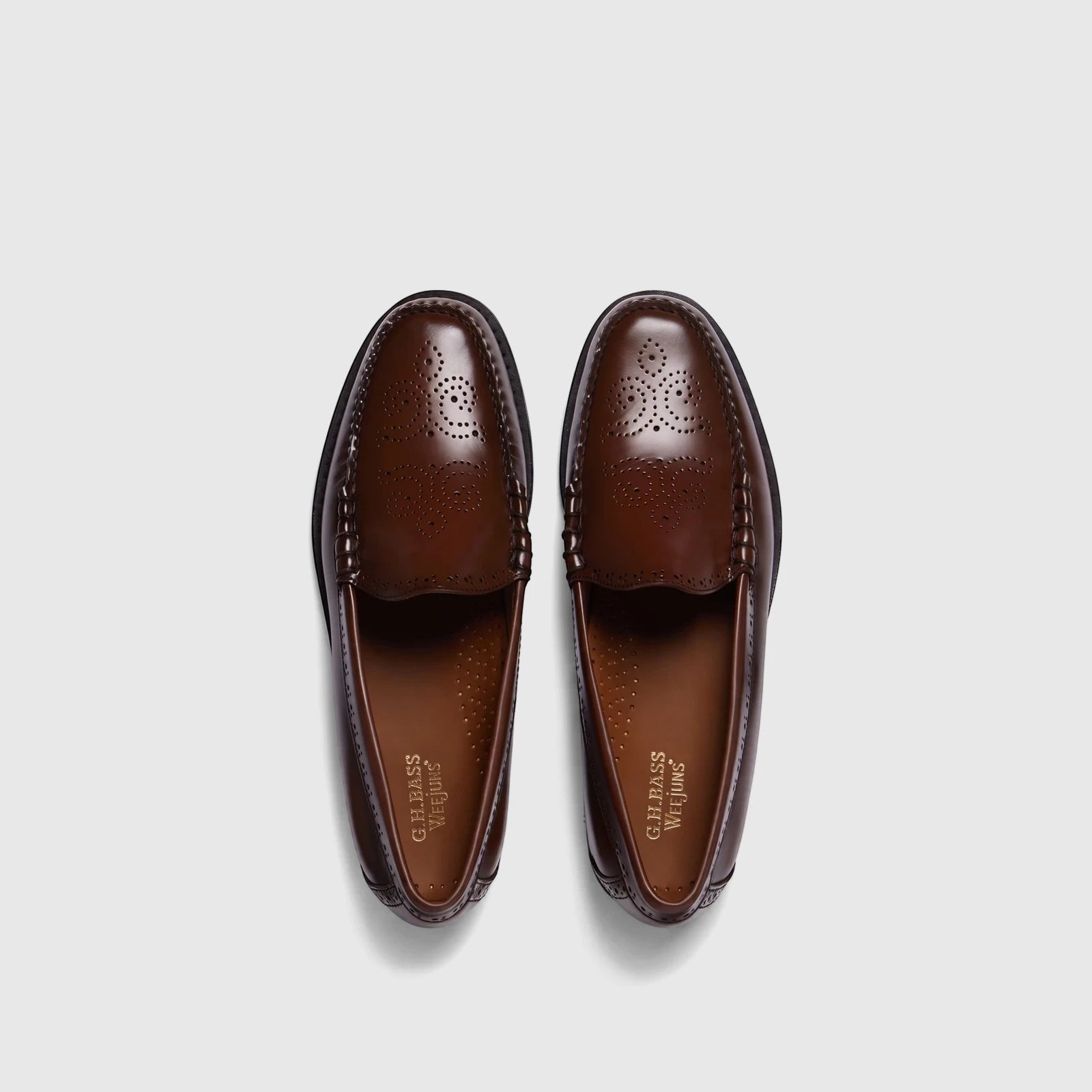 Two G.H. Bass Men's Weejun Venetian Brogue loafers in rich brown leather, arranged side-by-side from a top-down view.