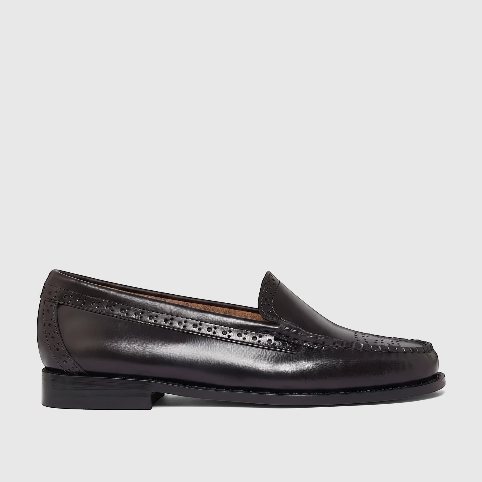 Bass Men's Weejun Venetian Brogue Loafer in black leather, featuring classic brogue detailing and a sophisticated profile.