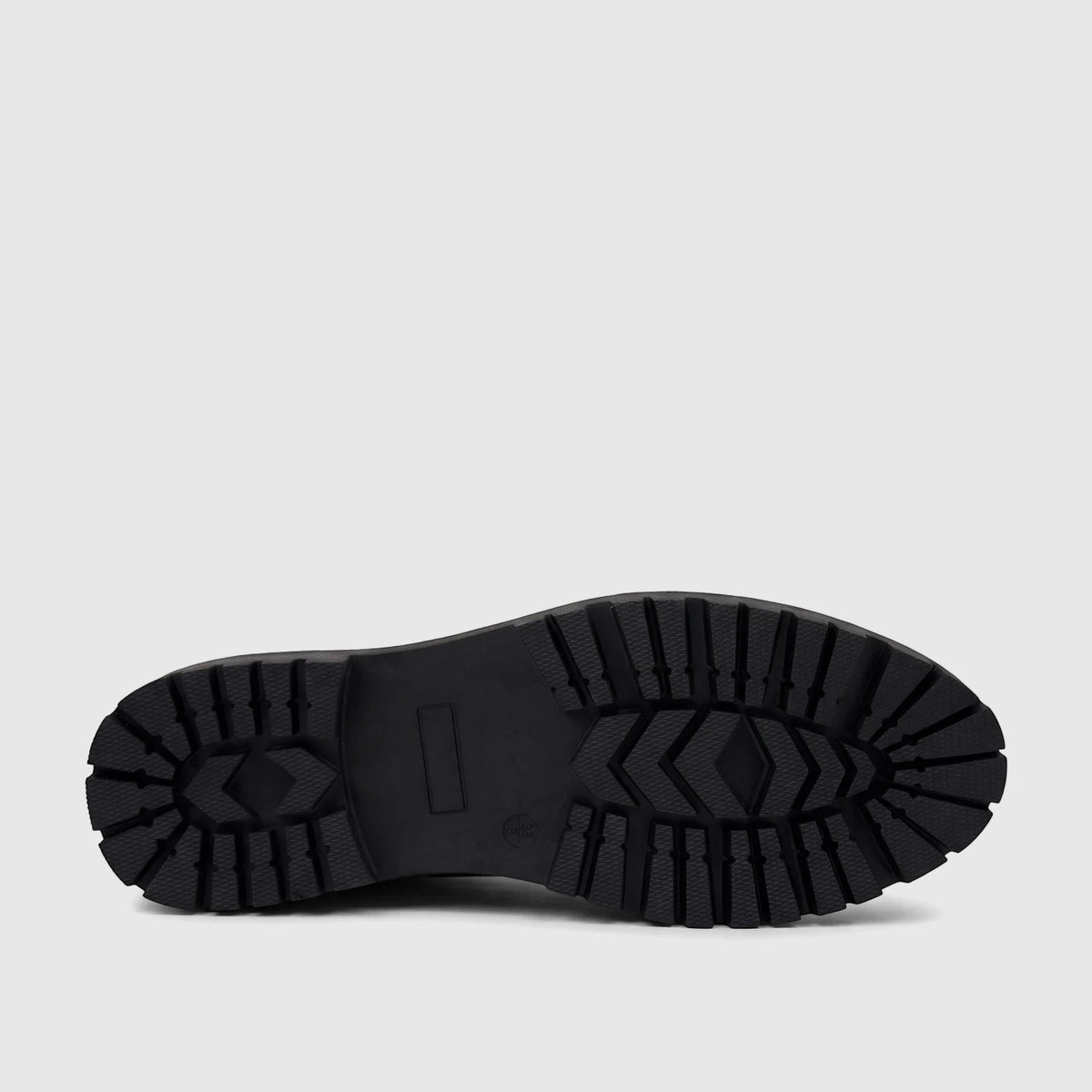 Bottom view of a black lug sole boot, showcasing its robust, patterned tread. Used for the PC Ladies Casual Loafer PCL10997.