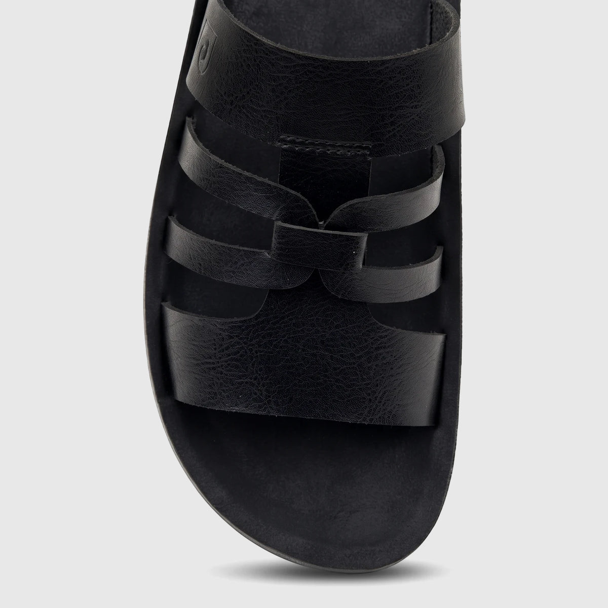 Close-up of a single black PC Ladies Casual Sandal with multiple textured leather straps and a comfortable footbed.