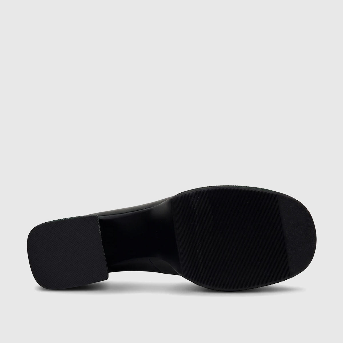 Bulbul Ladies black block heel Mary Jane shoe, viewed from below showing the patterned sole and block heel, with green