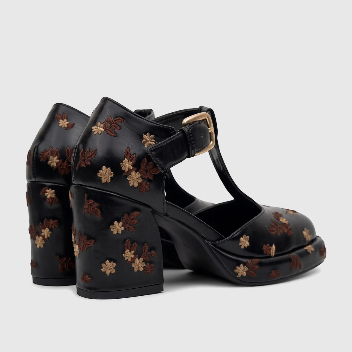 Pair of Bulbul Ladies Black Block Heel T-Bar Shoes with ornate brown and gold floral embroidery and a gold buckle, viewed