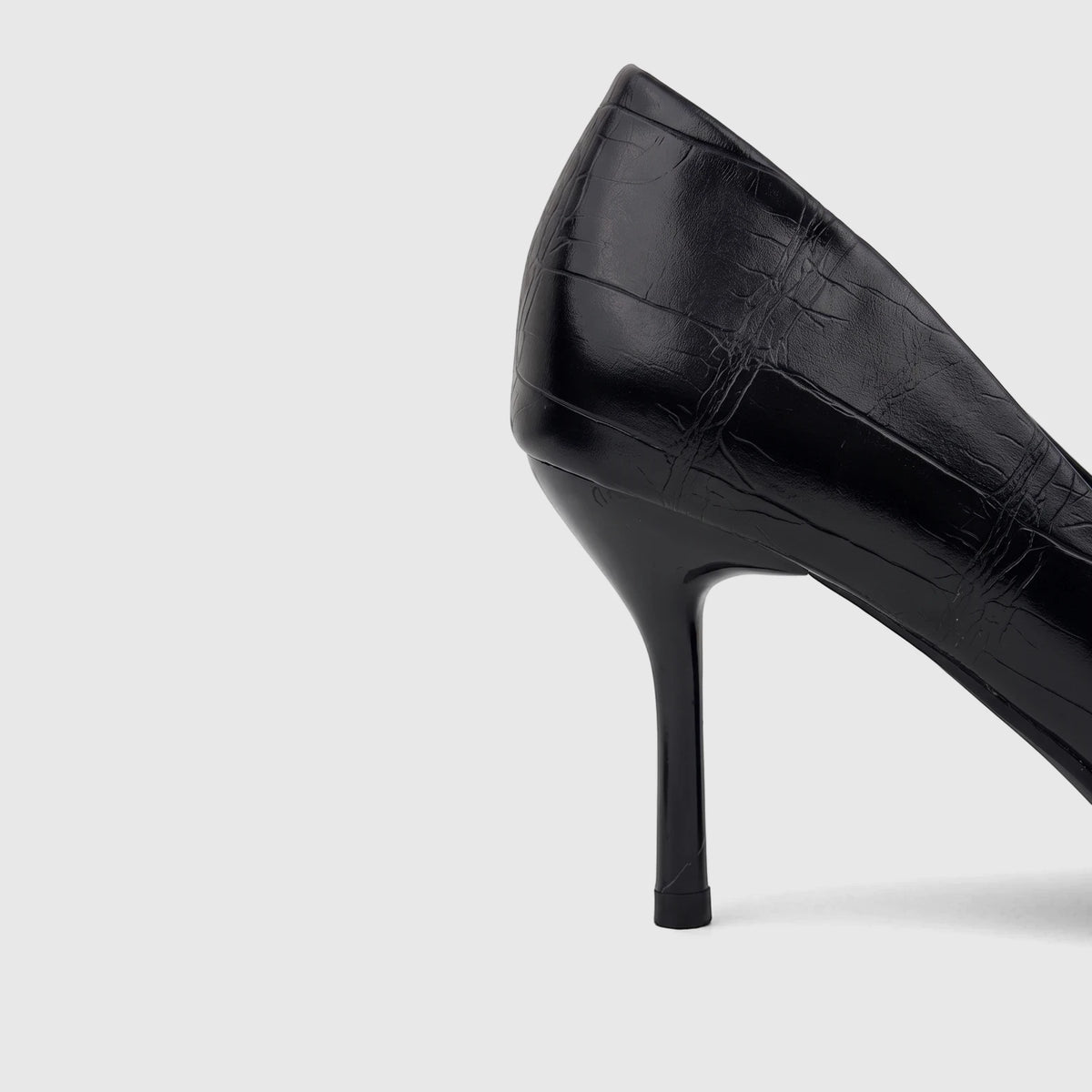 Black crocodile-textured Bulbul ladies' dress court shoe with a high heel, viewed from the side profile.