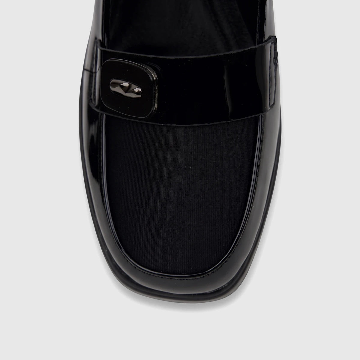 Close-up front view of a Bulbul ladies black patent loafer-style dress shoe with a decorative buckle detail.