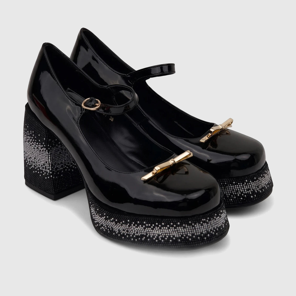Black patent leather Bulbul Ladies Mary Jane shoes with embellished block heels and platform soles, gold-tone buckles.