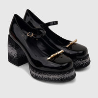 Black patent leather Bulbul Ladies Mary Jane shoes with embellished block heels and platform soles, gold-tone buckles.