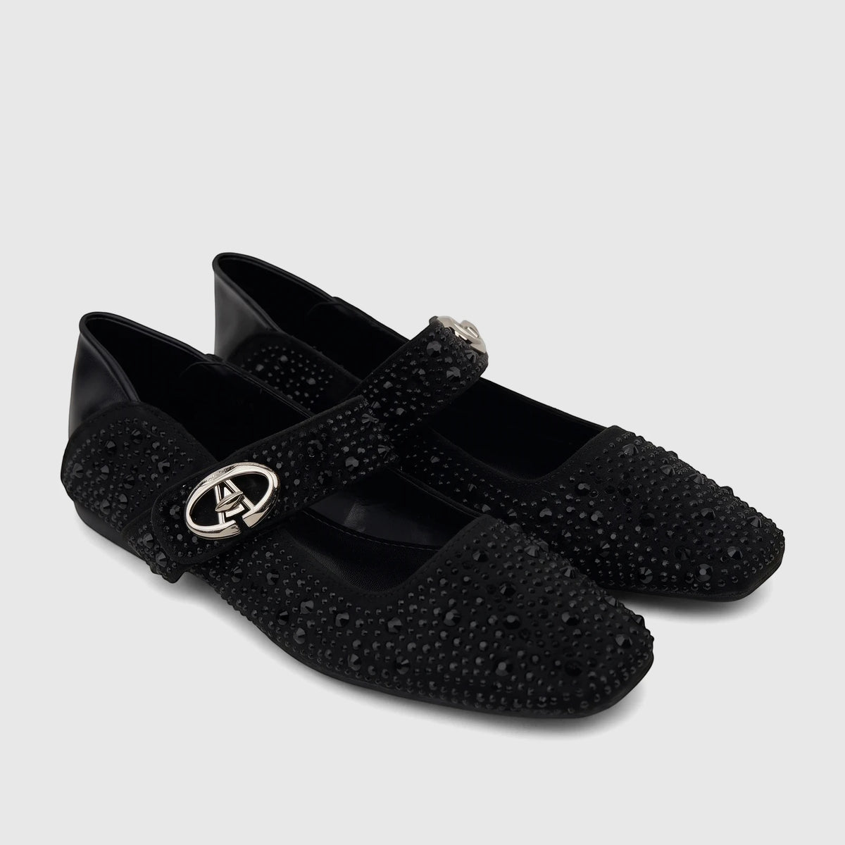 Pair of black Bulbul ladies' evening pumps, adorned with sparkling rhinestones and a Mary Jane strap with a silver buckle.