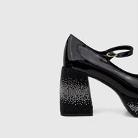 Bulbul Ladies Block Heel Mary Jane shoe in black patent leather, featuring a sparkling rhinestone-encrusted heel and strap