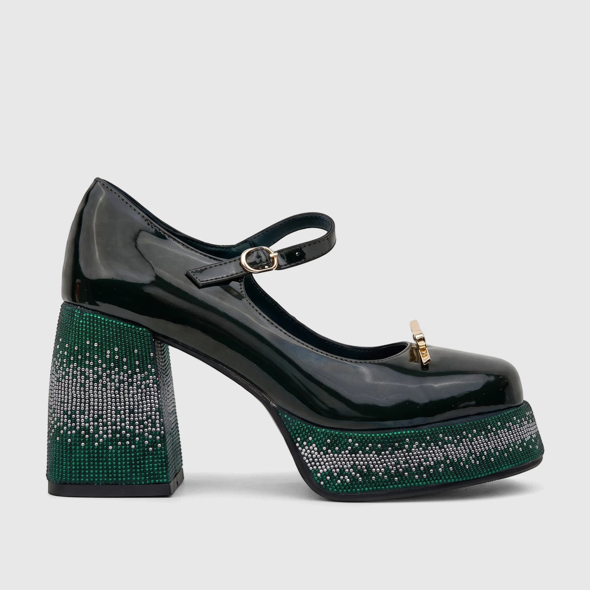Dark green patent leather ladies' Mary Jane shoe with a thick block heel and platform adorned with green and silver bling.