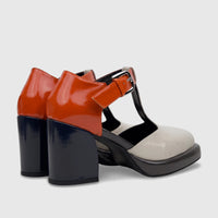 A pair of Bulbul Ladies Block Heel shoes in navy, grey, orange, and off-white patent leather with a T-bar strap and block