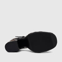 Underside view of a Bulbul Ladies Block Heel shoe in black, featuring a T-bar strap and visible sole tread.