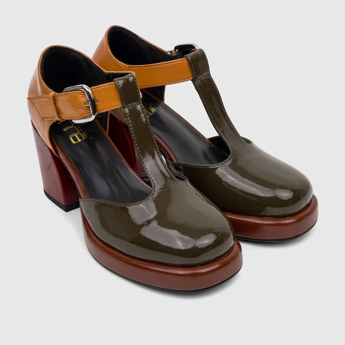 A pair of Bulbul Ladies Block Heel shoes with T-bar straps in khaki, brown, and orange patent leather, angled view.