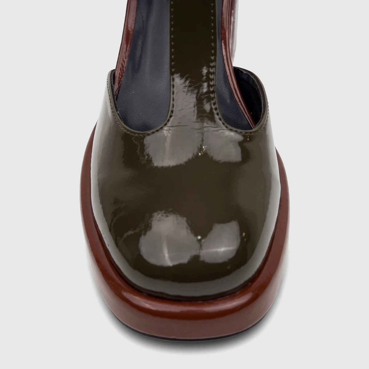 Close-up of Bulbul Ladies Block Heel with T-bar strap in glossy khaki patent leather and a brown platform sole.