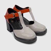 Pair of Bulbul Ladies Block Heel shoes with T-bar strap in glossy navy, grey, and orange patent leather.