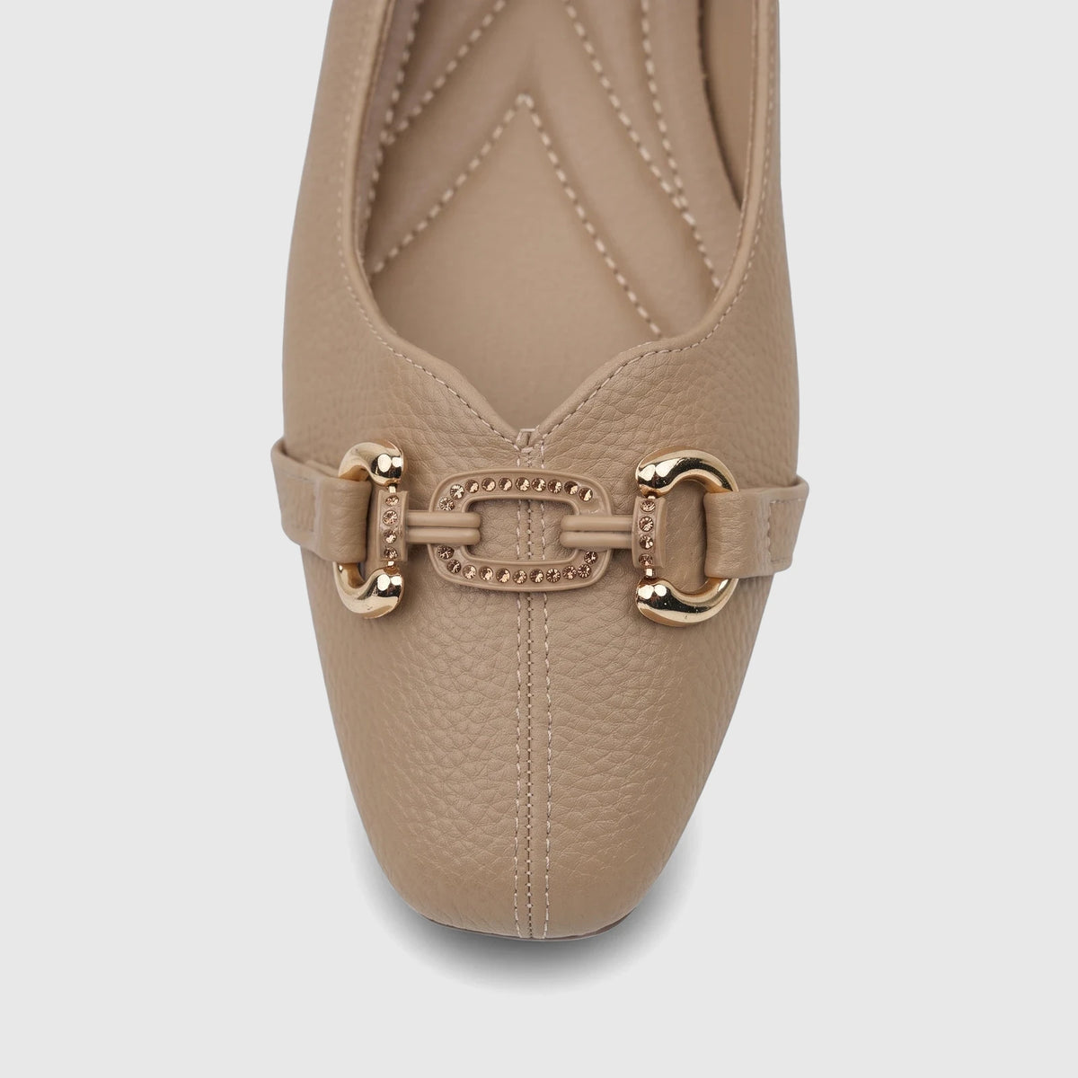 Close-up of a beige Bulbul ladies' casual pump with a textured upper and a gold-toned buckle embellishment.