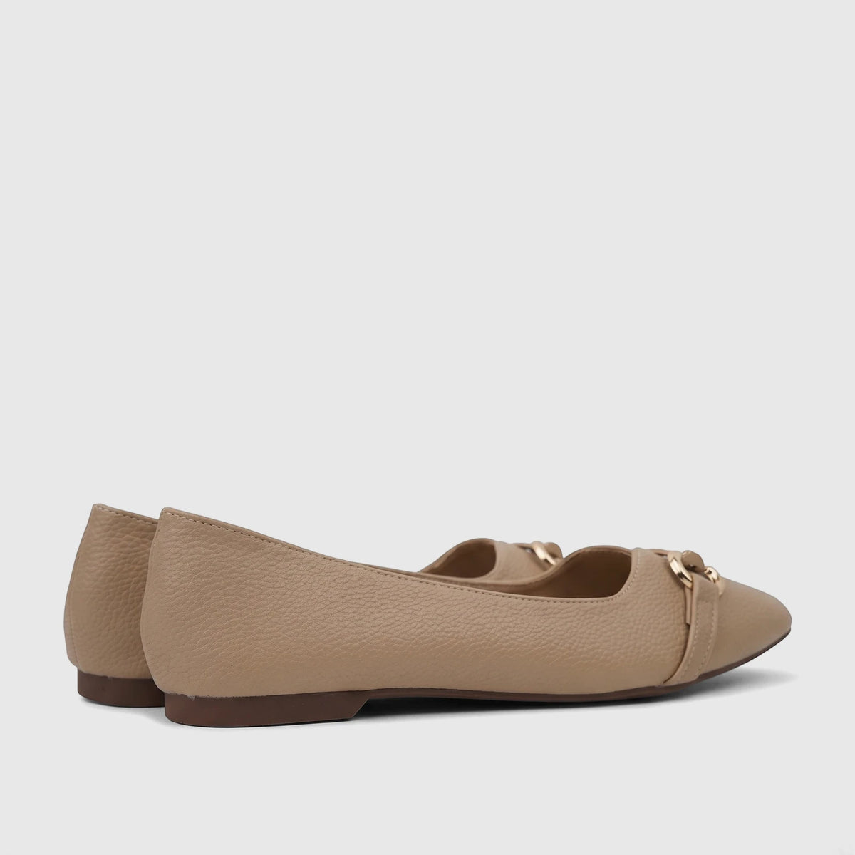 Beige pebbled faux leather Bulbul women's casual pump ballet flats with gold chain detail, viewed from the side.