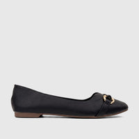 Side view of a single Bulbul Ladies Casual Pump in black textured faux leather with a prominent gold-tone buckle accent on