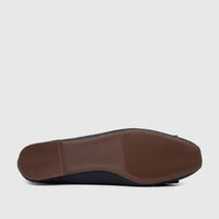 Navy textured synthetic leather casual pump shoe, size 38, featuring a brown ridged rubber sole, viewed from the bottom.