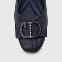 Close-up of a navy blue textured leather Bulbul Ladies Casual Pump with a prominent 'CD' logo buckle embellished with