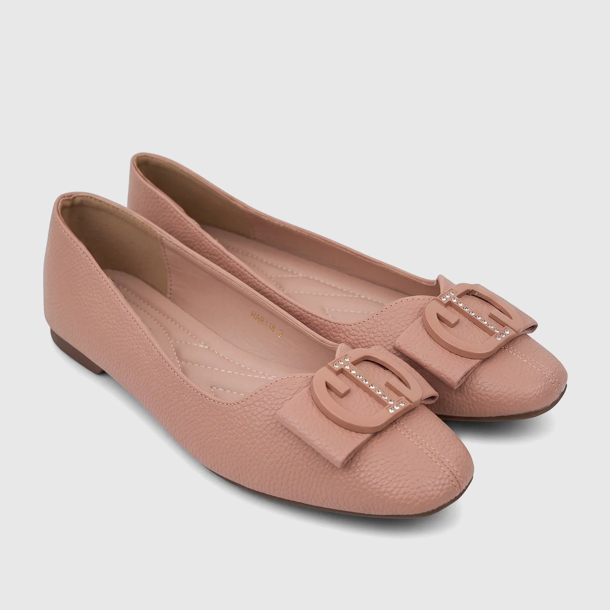A pair of pink pebbled texture Bulbul Ladies Casual Pump shoes with rhinestone-studded buckles, captured from an elevated