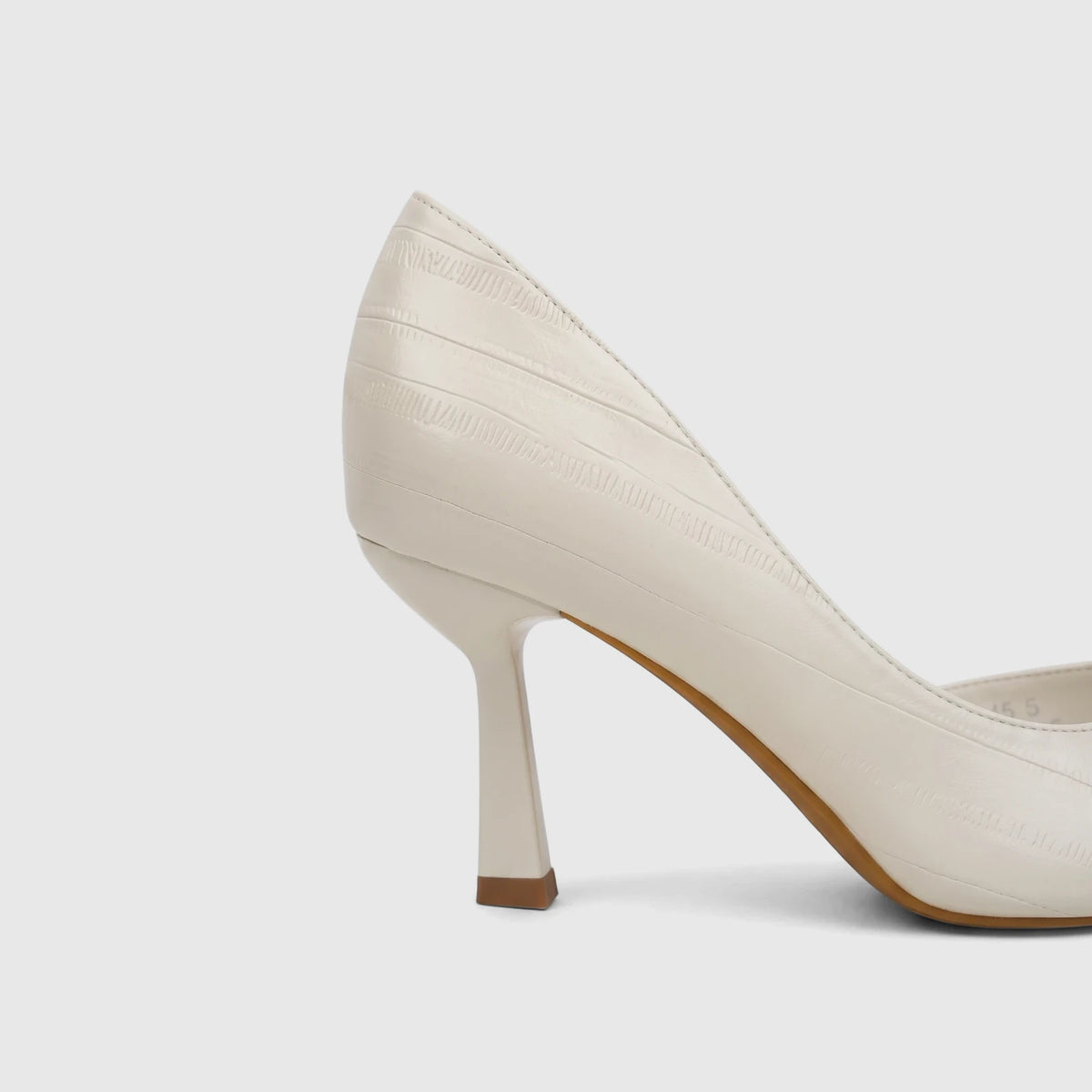 Bulbul Ladies Dress Open Waist Court Shoe in cream with a textured upper and high heel, shown from a side profile.